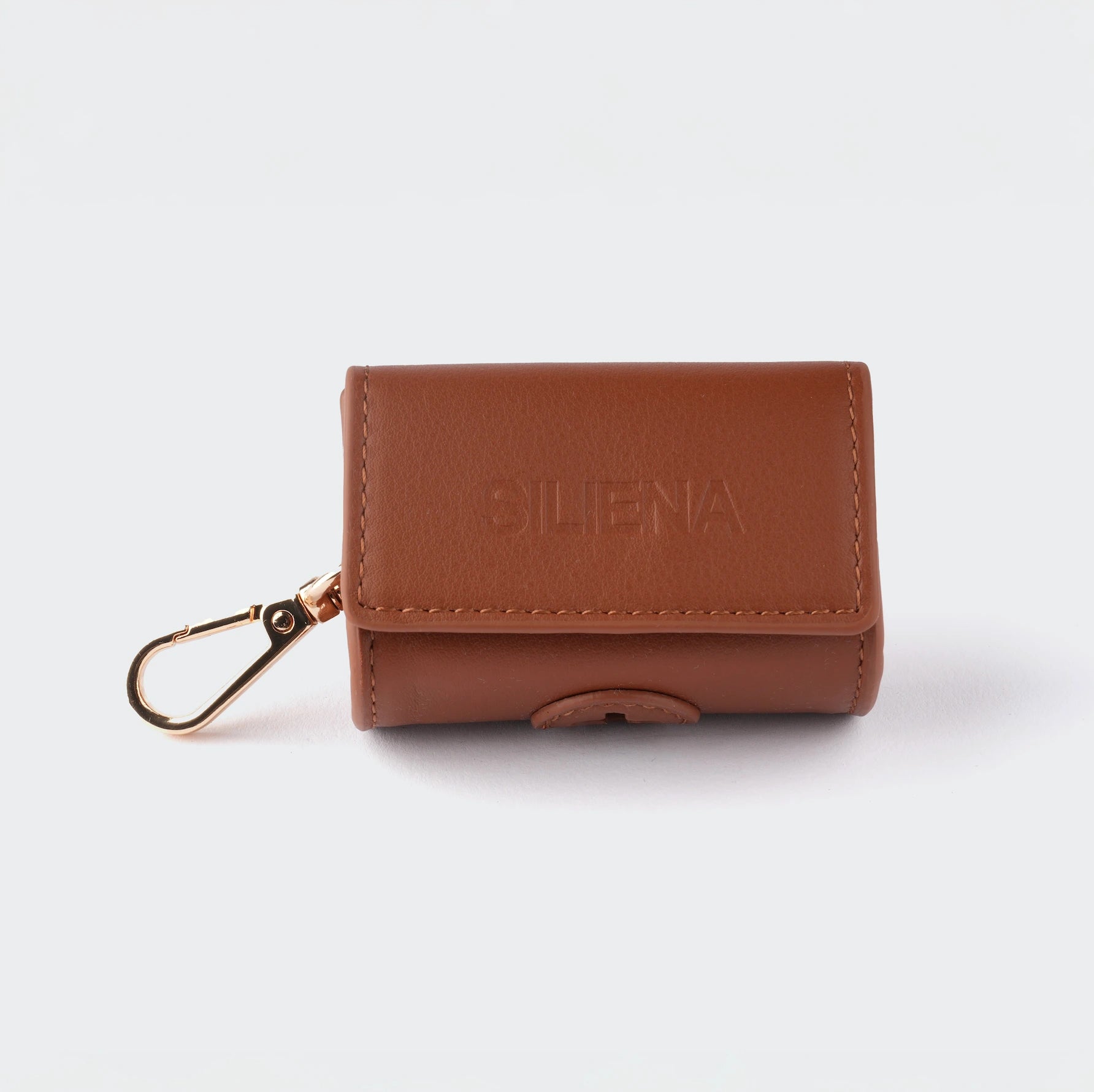 Brauner Siliena Kotbeutelhalter aus Kunstleder mit goldfarbenem Karabinerhaken.